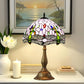 Stained-glass table lamp with multicolor dome shade and bronze metal pedestal base