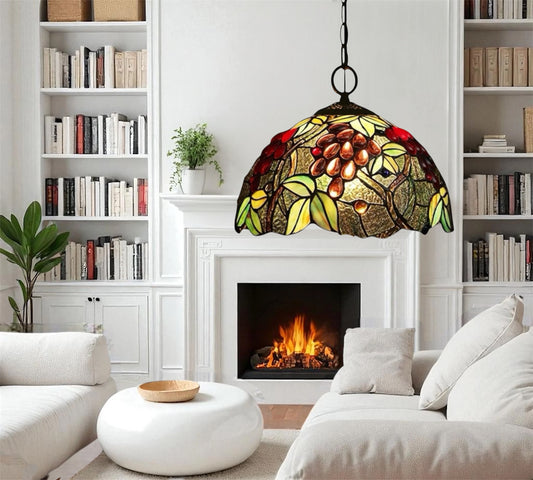 Stained glass pendant lamp with arched multicolor shade and hanging black metal cord.